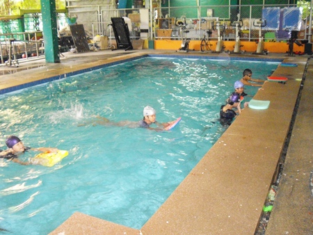 Blind school children learn to swim with the aid of the PSC.